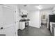 Bright and modern kitchen with stainless steel appliances, white cabinets, and sleek granite countertops at 5490 Chemin De Vie, Sandy Springs, GA 30342