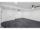 Bright, open living space with modern lighting, flooring and natural light with closet and arch entry at 5490 Chemin De Vie, Sandy Springs, GA 30342
