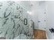 Modern bathroom showcasing a glass shower with marble tile and bench seating at 1835 Taylor Ave, East Point, GA 30344