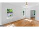 Bright bedroom features beautiful wood-look flooring and two sunny windows at 1835 Taylor Ave, East Point, GA 30344