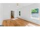 Large bedroom with hardwood floors, bright windows, recessed lighting, and ensuite bathroom at 1835 Taylor Ave, East Point, GA 30344