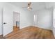 A bright bedroom with a wood-look floor is adjacent to a staircase at 1835 Taylor Ave, East Point, GA 30344