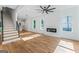 Spacious living room with a modern fireplace, lots of natural light, and hardwood floors throughout at 1835 Taylor Ave, East Point, GA 30344