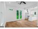 Open living room featuring hardwood floors and access to the kitchen at 1835 Taylor Ave, East Point, GA 30344