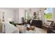 Bright living room features a modern coffee table, stylish console, and comfortable seating at 582 Silver Moon Dr, Loganville, GA 30052