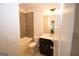 Well-lit bathroom featuring gray-tiled backsplash, dark vanity, and modern fixtures offering a clean and functional space at 756 Cady Way, Atlanta, GA 30312