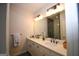 Bathroom featuring double sinks with quartz countertops and a large mirror at 756 Cady Way, Atlanta, GA 30312