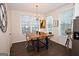 Charming dining area featuring a modern light fixture and bright windows at 756 Cady Way, Atlanta, GA 30312