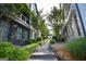 Charming walkway between homes, featuring lush landscaping, trees, and rock features, adding to the neighborhood's appeal at 756 Cady Way, Atlanta, GA 30312