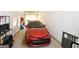 Attached garage featuring a red car, storage shelves, and access to the home at 756 Cady Way, Atlanta, GA 30312
