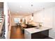 Open-concept kitchen with a spacious island, modern appliances, and a view into the dining area, great for entertaining at 756 Cady Way, Atlanta, GA 30312