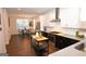 Bright, modern kitchen features stainless steel appliances and quartz countertops overlooking the dining area at 756 Cady Way, Atlanta, GA 30312