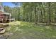 Manicured lawn and mature trees surround the home, offering a private retreat at 109 Cannon Road, Sharpsburg, GA 30277