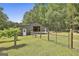 Side view of barn with fenced in area at 109 Cannon Road, Sharpsburg, GA 30277