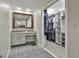 Well-lit bathroom with a vanity area and access to a walk-in closet at 109 Cannon Road, Sharpsburg, GA 30277