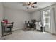 Bedroom with a desk, office chair, and a well-lit window at 109 Cannon Road, Sharpsburg, GA 30277