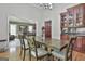 Inviting dining room features wood floors, modern lighting and wooden table with seating at 109 Cannon Road, Sharpsburg, GA 30277