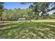 Expansive backyard with lush green lawn and shed, bordered by mature trees, creating a private oasis at 109 Cannon Road, Sharpsburg, GA 30277