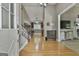 Warm and welcoming foyer with hardwood floors and an open staircase at 109 Cannon Road, Sharpsburg, GA 30277