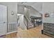 Inviting foyer featuring hardwood floors, staircase, and natural light at 109 Cannon Road, Sharpsburg, GA 30277