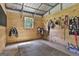Interior of a tidy horse stall with wooden walls, metal roof, and tack accessories at 109 Cannon Road, Sharpsburg, GA 30277
