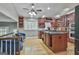 Open kitchen with cherry cabinets and a center island at 109 Cannon Road, Sharpsburg, GA 30277