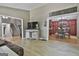 Open-concept living room with neutral walls and views into kitchen and entry at 109 Cannon Road, Sharpsburg, GA 30277