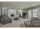 Spacious living room has natural light, a fireplace, and comfortable seating at 109 Cannon Road, Sharpsburg, GA 30277