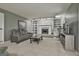 Spacious living room with brick fireplace, built-in shelves, and neutral carpeting at 109 Cannon Road, Sharpsburg, GA 30277