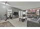 Cozy living room with direct access to the kitchen and large windows at 109 Cannon Road, Sharpsburg, GA 30277