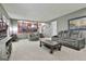 Comfortable living room featuring stairs leading up to the kitchen area and a plush sofa at 109 Cannon Road, Sharpsburg, GA 30277