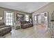 Cozy living room features neutral walls, natural light, and comfortable seating at 109 Cannon Road, Sharpsburg, GA 30277