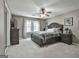 Inviting main bedroom with soft lighting, a ceiling fan, and large windows at 109 Cannon Road, Sharpsburg, GA 30277