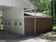 Garage/Carport attached to the home with brick siding and white paint at 2934 Union Grove Rd, Conyers, GA 30012