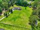 Expansive aerial shot featuring a large home with a sprawling green lawn and mature trees at 260 Sams Dr, Fayetteville, GA 30214