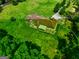 Aerial view showcasing a home surrounded by lush trees and ample yard space at 260 Sams Dr, Fayetteville, GA 30214