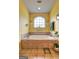 The bathroom features a luxurious soaking tub and large arched window at 260 Sams Dr, Fayetteville, GA 30214