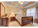 Bedroom features a tray ceiling, warm color palette, and plush carpeting at 260 Sams Dr, Fayetteville, GA 30214