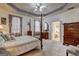 Spacious main bedroom with sitting area, four poster bed, and en-suite bathroom at 260 Sams Dr, Fayetteville, GA 30214
