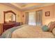 A relaxing bedroom features a wood dresser, and a large window with filtered natural light at 260 Sams Dr, Fayetteville, GA 30214