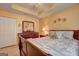 Bright bedroom featuring a wood sleigh bed, a matching dresser, and a decorative motif on the walls at 260 Sams Dr, Fayetteville, GA 30214