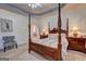 Bedroom with a four poster bed and an ensuite bath with plenty of room to relax at 260 Sams Dr, Fayetteville, GA 30214