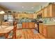 Well-equipped kitchen with stainless steel appliances, granite countertops, and ample cabinet space for storage at 260 Sams Dr, Fayetteville, GA 30214