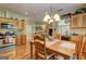Open-concept kitchen with wood cabinets, stainless steel appliances, and an adjacent dining area for casual meals at 260 Sams Dr, Fayetteville, GA 30214