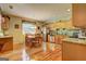 Open kitchen and dining area with modern appliances, wood cabinets, and lots of natural light at 260 Sams Dr, Fayetteville, GA 30214