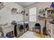 A functional laundry room with modern washer and dryer units, a utility sink, and ample storage space at 260 Sams Dr, Fayetteville, GA 30214