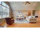 Spacious living room boasts hardwood floors, a ceiling fan, and a large window for abundant natural light at 260 Sams Dr, Fayetteville, GA 30214