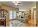 Cozy living room featuring hardwood floors, a ceiling fan, and easy access to the kitchen at 260 Sams Dr, Fayetteville, GA 30214