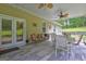 Cozy covered patio featuring ceiling fans, dining set, and a relaxing outdoor space at 260 Sams Dr, Fayetteville, GA 30214