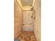 Walk-in shower boasts tiled walls, built-in bench, and rainfall shower head at 260 Sams Dr, Fayetteville, GA 30214